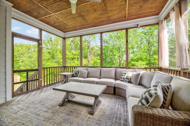 sunroom / solarium featuring ceiling fan, outdoor lounge area, and plenty of natural light