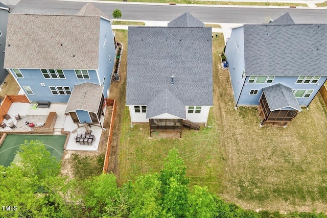 birds eye view of property with a residential view