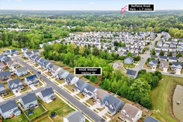 birds eye view of property with a residential view