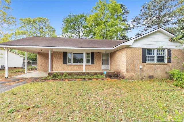 single story home featuring crawl space, aphalt driveway, brick siding, a front lawn, and an attached carport