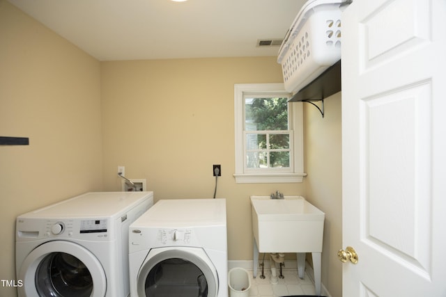 221 Ironwoods Dr, Chapel Hill, NC 27516 - laundry room featuring light tile patterned floors, laundry area, baseboards, visible vents, and independent washer and dryer