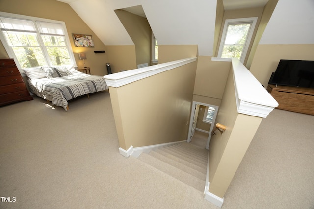 221 Ironwoods Dr, Chapel Hill, NC 27516 - bedroom featuring lofted ceiling, baseboards, and carpet floors