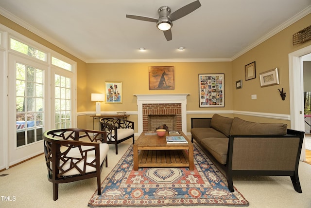 221 Ironwoods Dr, Chapel Hill, NC 27516 - living room featuring a ceiling fan, a brick fireplace, ornamental molding, and light colored carpet