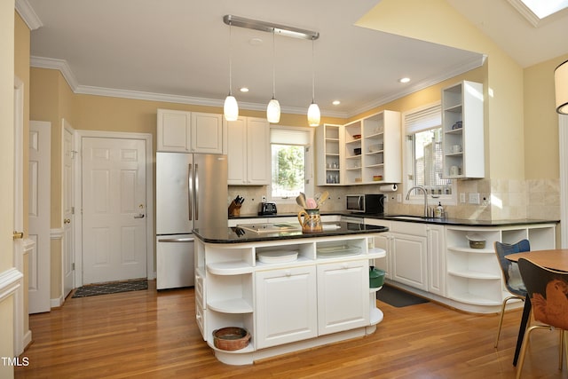 221 Ironwoods Dr, Chapel Hill, NC 27516 - kitchen featuring stainless steel appliances, open shelves, dark countertops, a sink, and light wood-style floors