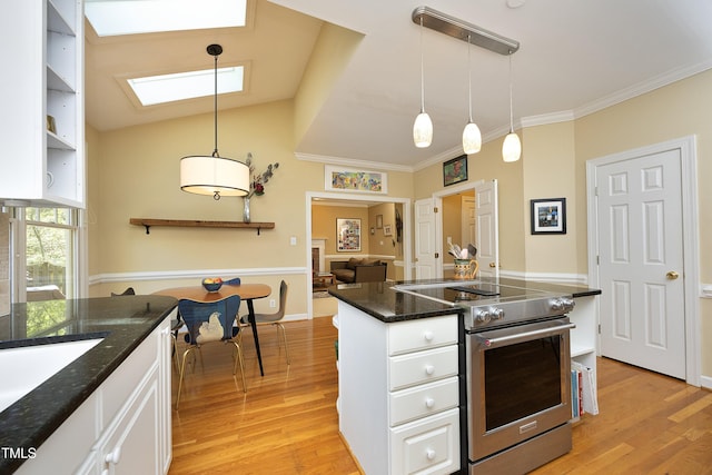 221 Ironwoods Dr, Chapel Hill, NC 27516 - kitchen featuring light wood-type flooring, high end stainless steel range oven, white cabinetry, and ornamental molding