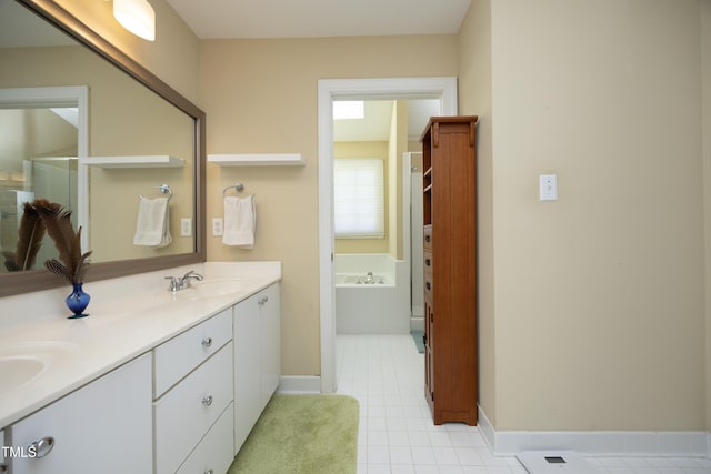 221 Ironwoods Dr, Chapel Hill, NC 27516 - full bath with tile patterned floors, double vanity, a sink, a bath, and baseboards
