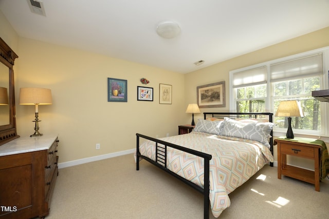 221 Ironwoods Dr, Chapel Hill, NC 27516 - bedroom featuring baseboards, visible vents, and light colored carpet