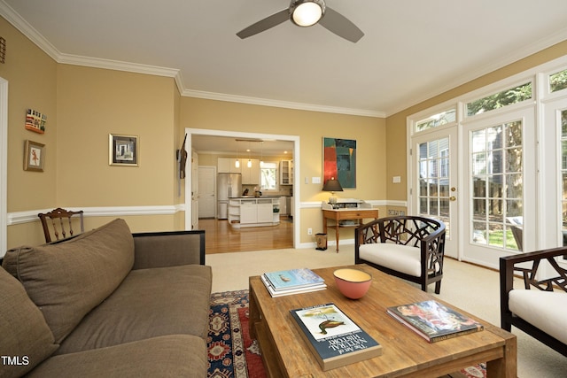 221 Ironwoods Dr, Chapel Hill, NC 27516 - living area featuring a ceiling fan, light carpet, and crown molding