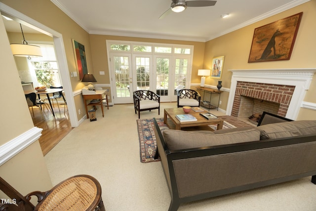 221 Ironwoods Dr, Chapel Hill, NC 27516 - living area with carpet, ceiling fan, crown molding, and a healthy amount of sunlight