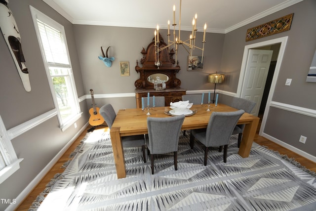 221 Ironwoods Dr, Chapel Hill, NC 27516 - dining space featuring a chandelier, wood finished floors, crown molding, and baseboards