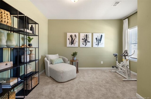 1616 Elk Run Dr, Fayetteville, NC 28312 - living area with visible vents, baseboards, and carpet
