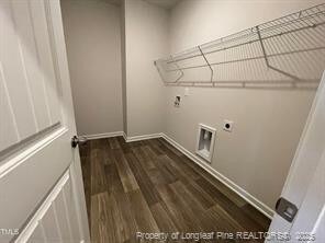 1616 Elk Run Dr, Fayetteville, NC 28312 - laundry area featuring laundry area, wood finished floors, hookup for an electric dryer, and baseboards