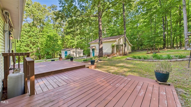196 Tara Ln, Timberlake, NC 27583 - wooden terrace with a lawn, an outbuilding, and a storage unit