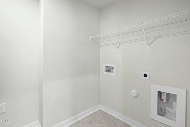 laundry room with baseboards, washer hookup, laundry area, gas dryer hookup, and electric dryer hookup