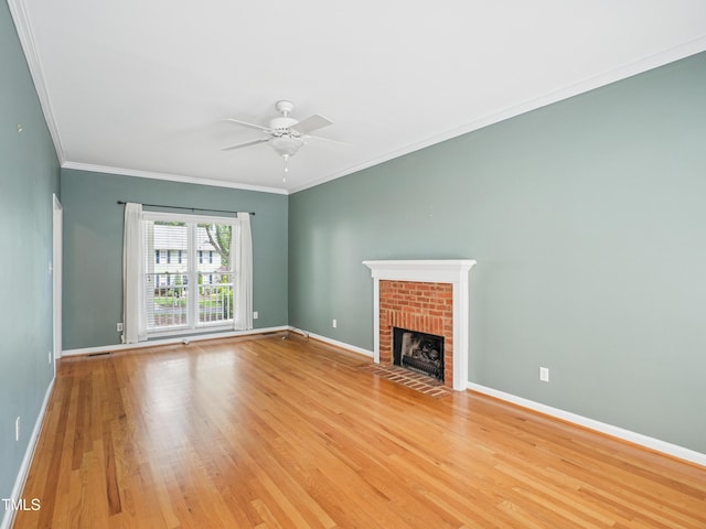 3303 Glen Currin Dr, Raleigh, NC 27612 - unfurnished living room with a ceiling fan, baseboards, light wood-style floors, a brick fireplace, and ornamental molding