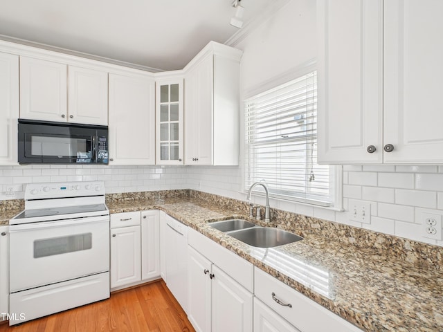 3303 Glen Currin Dr, Raleigh, NC 27612 - kitchen featuring black microwave, electric range, a sink, and white cabinetry