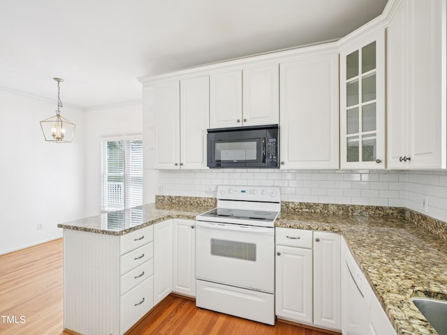 3303 Glen Currin Dr, Raleigh, NC 27612 - kitchen with black microwave, white electric stove, a peninsula, tasteful backsplash, and ornamental molding