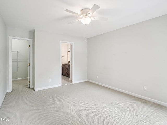 3303 Glen Currin Dr, Raleigh, NC 27612 - unfurnished bedroom with light carpet, a spacious closet, baseboards, and a closet