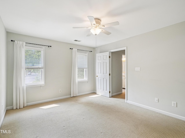 3303 Glen Currin Dr, Raleigh, NC 27612 - spare room featuring light carpet, a ceiling fan, and baseboards