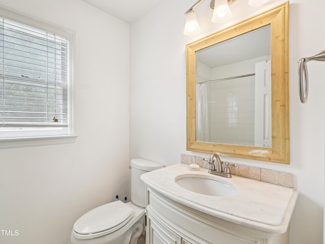 3303 Glen Currin Dr, Raleigh, NC 27612 - full bathroom with toilet, vanity, healthy amount of natural light, and curtained shower