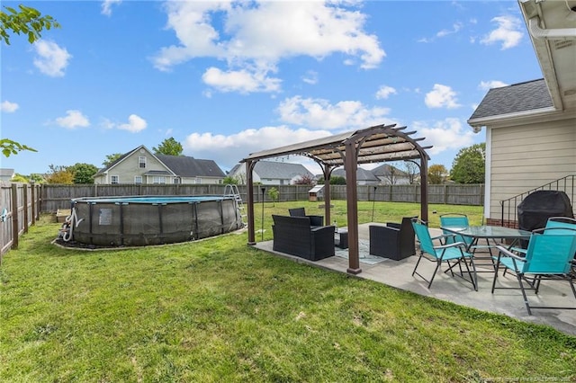 view of yard featuring a pergola, a fenced in pool, a patio area, and a fenced backyard