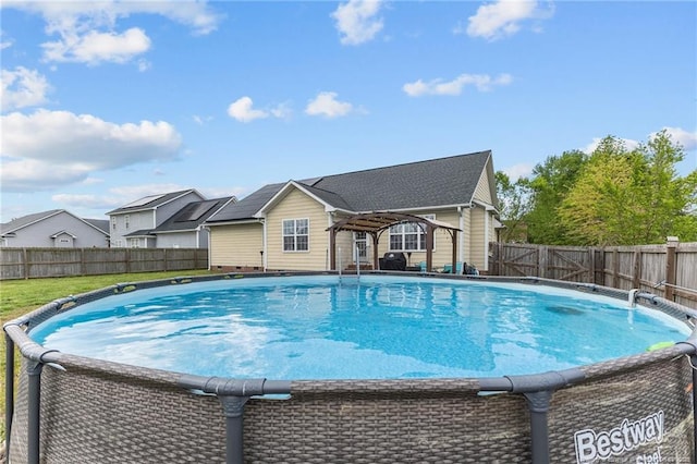 view of swimming pool with a fenced backyard and a fenced in pool