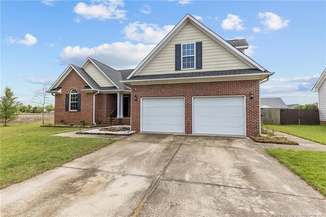 traditional home featuring roof with shingles, fence, a front lawn, brick siding, and driveway