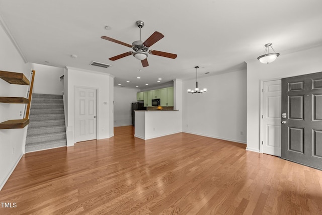 1120 Renewal Pl Unit 111, Raleigh, NC 27603 - unfurnished living room featuring ceiling fan, baseboards, ornamental molding, light wood-style flooring, and stairs