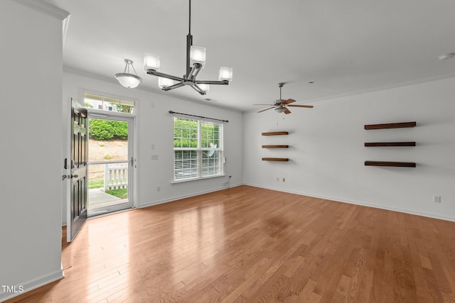 1120 Renewal Pl Unit 111, Raleigh, NC 27603 - unfurnished living room featuring a chandelier, crown molding, light wood-style floors, a ceiling fan, and baseboards