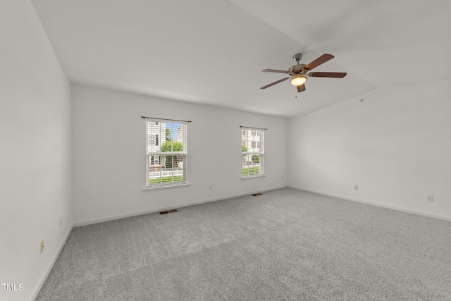 1120 Renewal Pl Unit 111, Raleigh, NC 27603 - empty room with carpet floors, vaulted ceiling, a ceiling fan, and baseboards