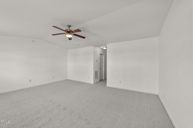 1120 Renewal Pl Unit 111, Raleigh, NC 27603 - unfurnished room featuring light carpet, baseboards, ceiling fan, and vaulted ceiling