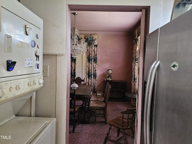500 W Main St, Benson, NC 27504 - kitchen featuring freestanding refrigerator, stacked washer / dryer, carpet floors, white cabinets, and light countertops