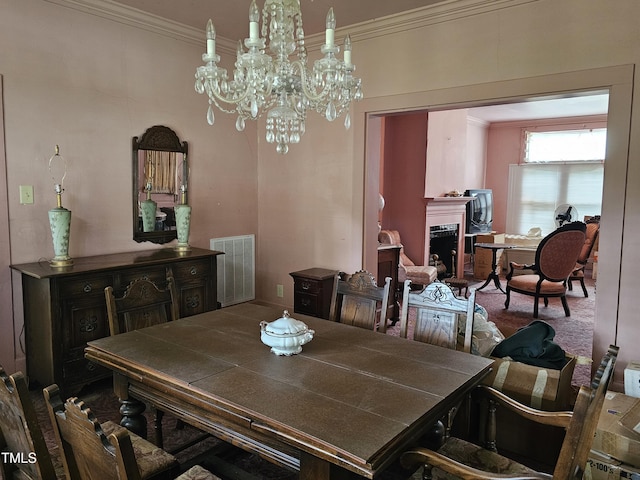 500 W Main St, Benson, NC 27504 - dining room featuring crown molding, a chandelier, and a fireplace
