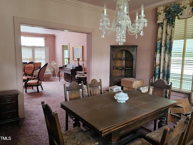500 W Main St, Benson, NC 27504 - carpeted dining area featuring ornamental molding, healthy amount of natural light, and a chandelier