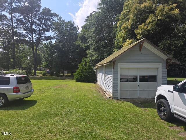 500 W Main St, Benson, NC 27504 - detached garage featuring driveway