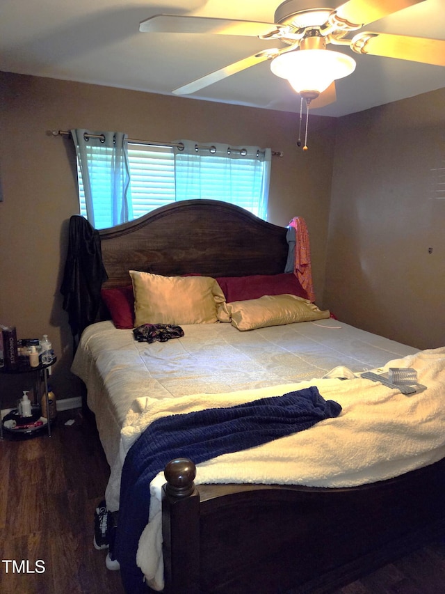 bedroom with wood finished floors and ceiling fan