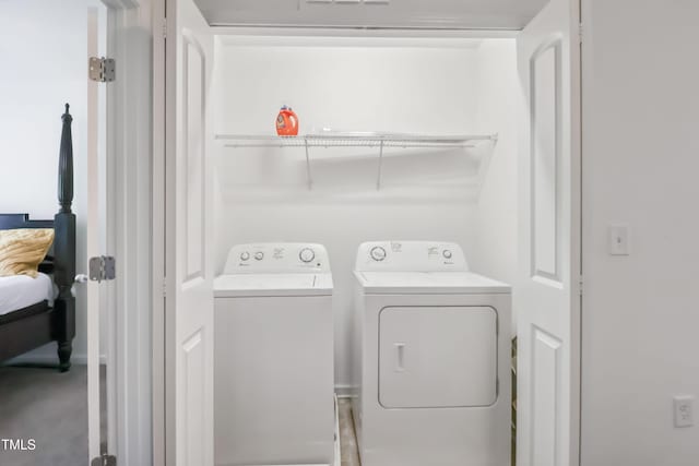 laundry room featuring washer and clothes dryer and laundry area