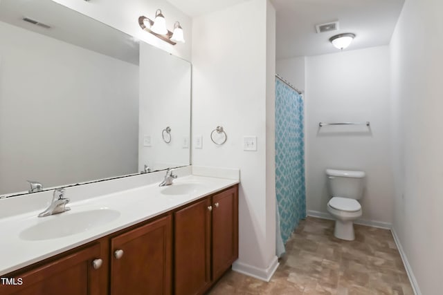 full bathroom with toilet, a sink, visible vents, and double vanity