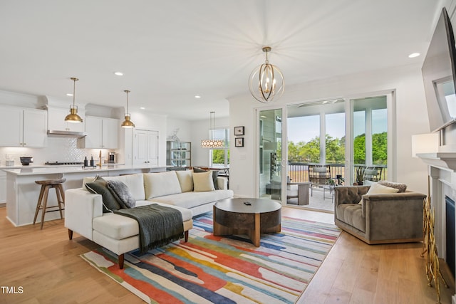 143 Sallyport Ct, Raleigh, NC 27603 - living area with a chandelier, recessed lighting, and light wood finished floors