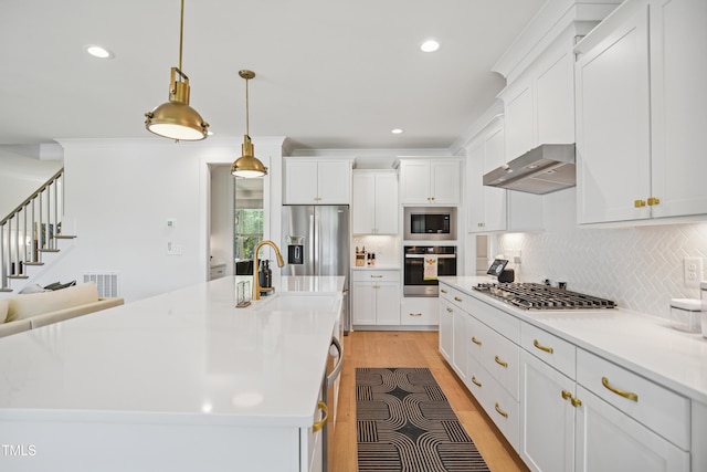 143 Sallyport Ct, Raleigh, NC 27603 - kitchen with white cabinetry, decorative backsplash, ventilation hood, and stainless steel appliances