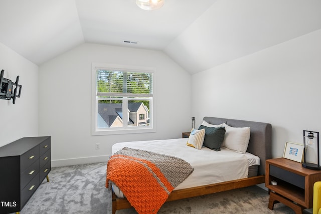 143 Sallyport Ct, Raleigh, NC 27603 - bedroom with baseboards, visible vents, light colored carpet, and vaulted ceiling