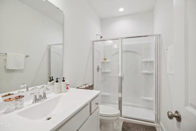 143 Sallyport Ct, Raleigh, NC 27603 - bathroom featuring a shower stall, vanity, marble finish floor, and toilet