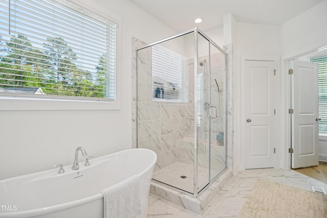 143 Sallyport Ct, Raleigh, NC 27603 - full bath with a shower stall, a freestanding tub, and marble finish floor