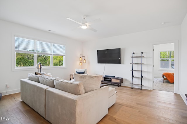 143 Sallyport Ct, Raleigh, NC 27603 - living room with visible vents, light wood-style flooring, a ceiling fan, and baseboards
