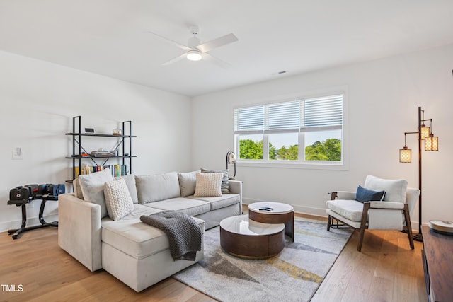 143 Sallyport Ct, Raleigh, NC 27603 - living room featuring baseboards, light wood-style floors, visible vents, and a ceiling fan