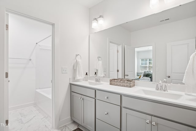 143 Sallyport Ct, Raleigh, NC 27603 - ensuite bathroom with a sink, visible vents, marble finish floor, and ensuite bathroom