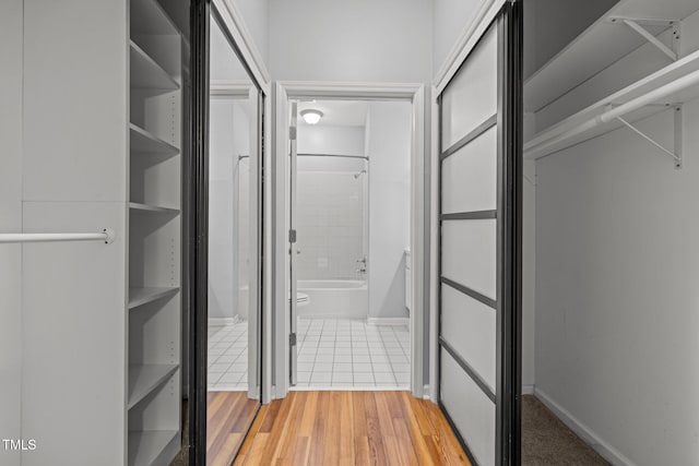 8231 Allyns Landing Way Unit 101, Raleigh, NC 27615 - walk in closet featuring light wood-style flooring