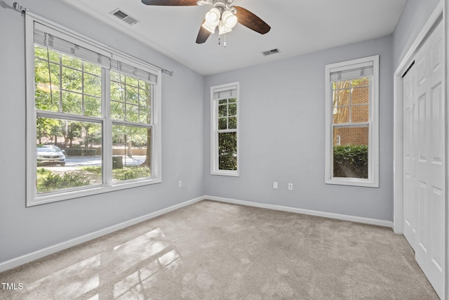 8231 Allyns Landing Way Unit 101, Raleigh, NC 27615 - unfurnished bedroom featuring carpet, a closet, and ceiling fan
