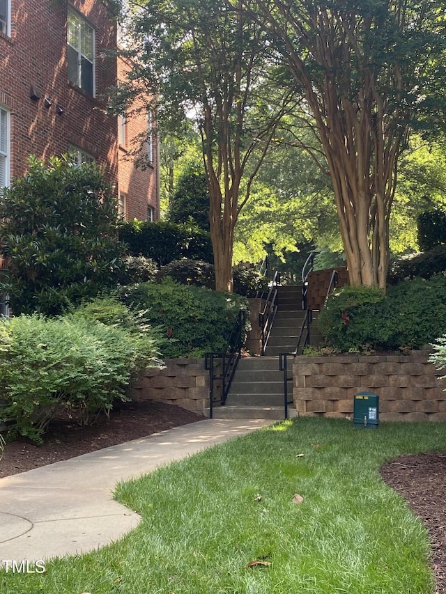 8231 Allyns Landing Way Unit 101, Raleigh, NC 27615 - surrounding community featuring stairway and a yard