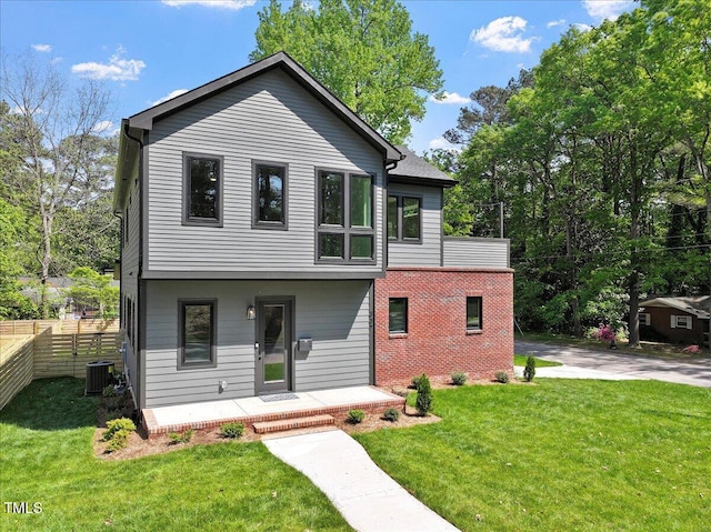 337 Merrywood Dr, Raleigh, NC 27610 - view of front of house with fence, covered porch, cooling unit, and a front yard
